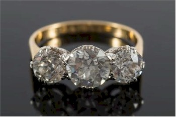 A Diamond Mounted Three-stone Ring (FS27/260) sold for £6,800 in the jewellery auction.