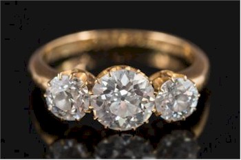 This early 20th Century Gold and Diamond Mounted Three-stone Ring (FS28/286) is expected to realise between £5,000 and £7,000.