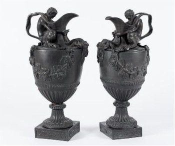 Two Wedgwood 'Sacred to Bacchus' black basalt wine ewers (FS29/527) in neo-classical style after a design by John Flaxman.