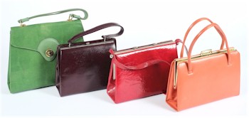 A green 'snake skin' hand bag together with various red, orange and purple hand bags are expected to fetch between £40-£60 at the auction in Exeter (SS1/14).