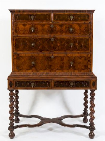 An early 18th Century walnut oyster veneer crossbanded and inlaid chest on later stand (FS29/929).