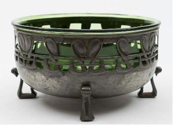 The sale also includes another Archibald Knox design: A Tudric Pewter and Green Glass Bowl (FS29/801).