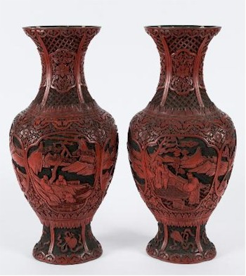 The sale includes a pair of Chinese two-colour cinnabar lacquer carved vases of lobed baluster form with waisted neck and flared rim (FS29/729).