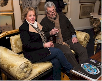 Trish and Phil Burchell find a comfortable spot at the Private View, which was held at the South West of England Saleroom Complex in Exeter.