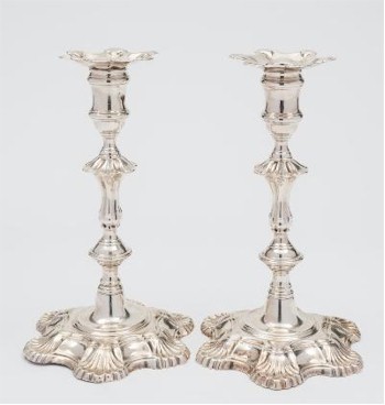 A pair of George II Cast Silver Candlesticks (FS31/147) produced in 1750 by silversmith John Cafe of London are expected to fetch
       between £2,500 and £3,000.