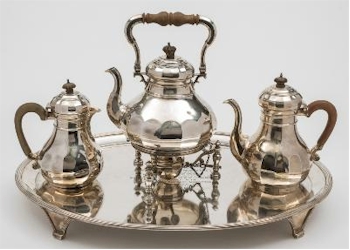 A George V silver four piece part tea and coffee service (FS32/34) by Mappin &
        Webb of London is also being offered in the sale.