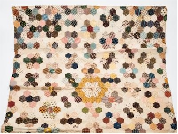 An early 19th Century Patchwork Quilt (SC23/431) is inviting bids between £150 and £250.
