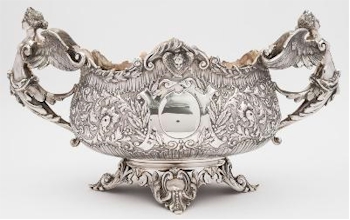 The silver auction also includes an impressive Edward VII Silver Two-handled Centre
        Bowl by the Goldsmiths and Silversmiths Co Ltd (FS33/148), which is inviting offers
        of between £2,500 and £3,500.