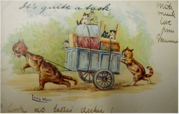 A Louis Wain postcard featuring anthropomorphised cats and a cart.