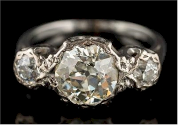 An Illusion-set Diamond Three-stone Ring (FS42/389).