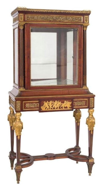 A Fine Louis XVI Style Mahogany and Gilt Metal Mounted Vitrine in the manner of
        Paul Sormani (FS42/1033), which went under the hammer for £5,600.