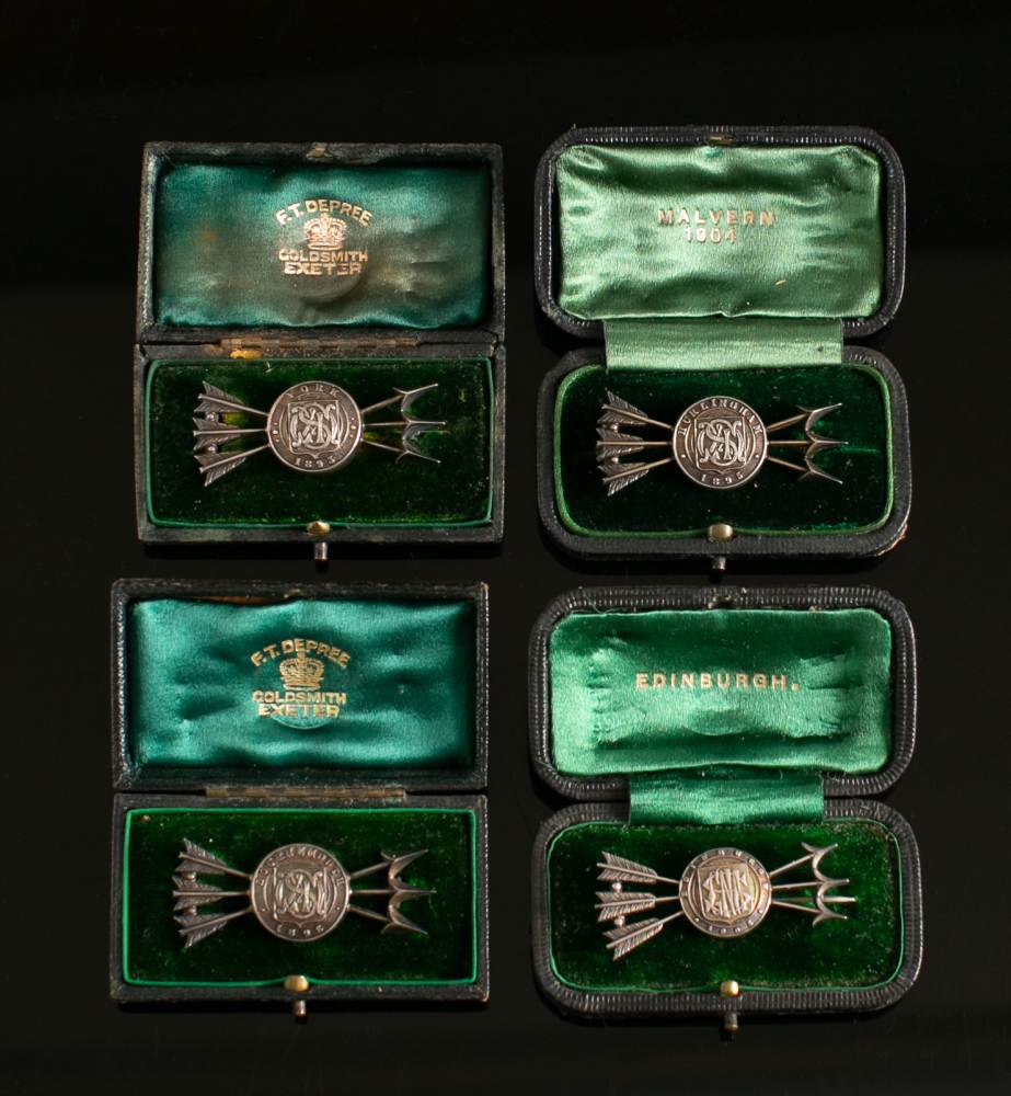 Four Victorian White Metal Archery Trophy Brooches Each In The Form Of A Monogrammed Target