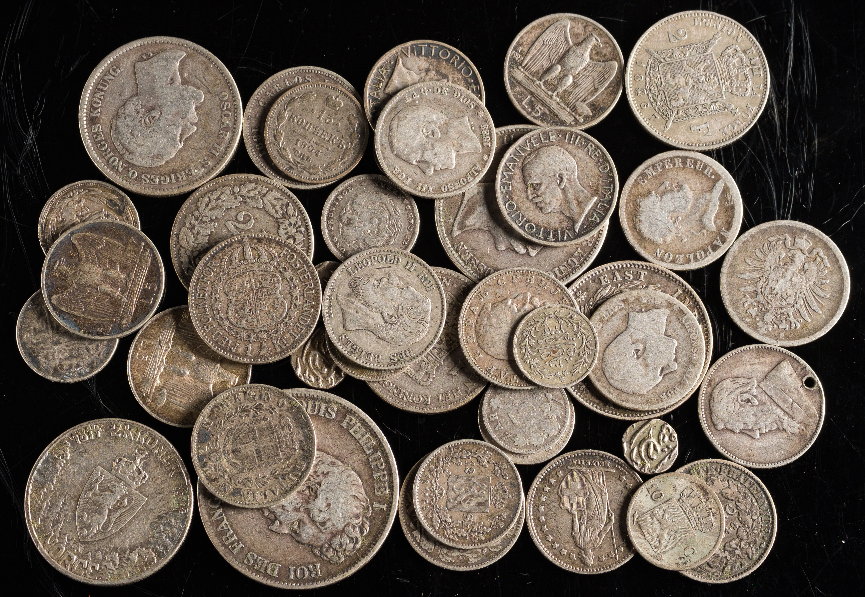 A Good Selection Of World Silver Coins. Including A Napoleon 1808 Franc, An 1831 5 Franc, An East India Company Rupee 1840 Etc.