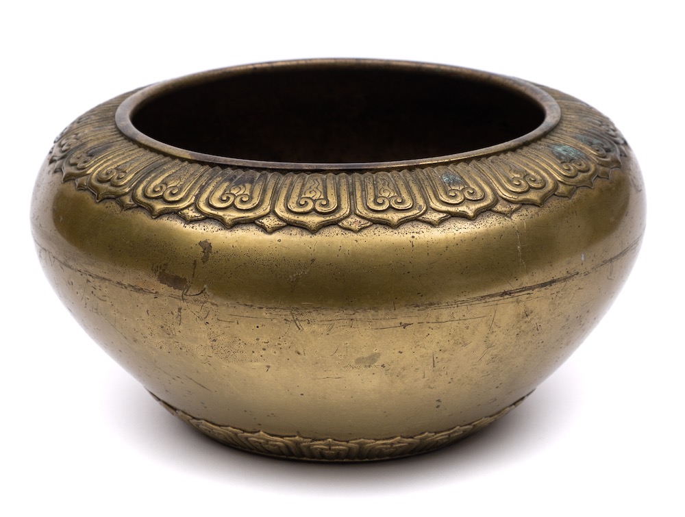 A Large Chinese Bronze Censer Of Squat Circular Form With Lotus Leaf Decorated Rim